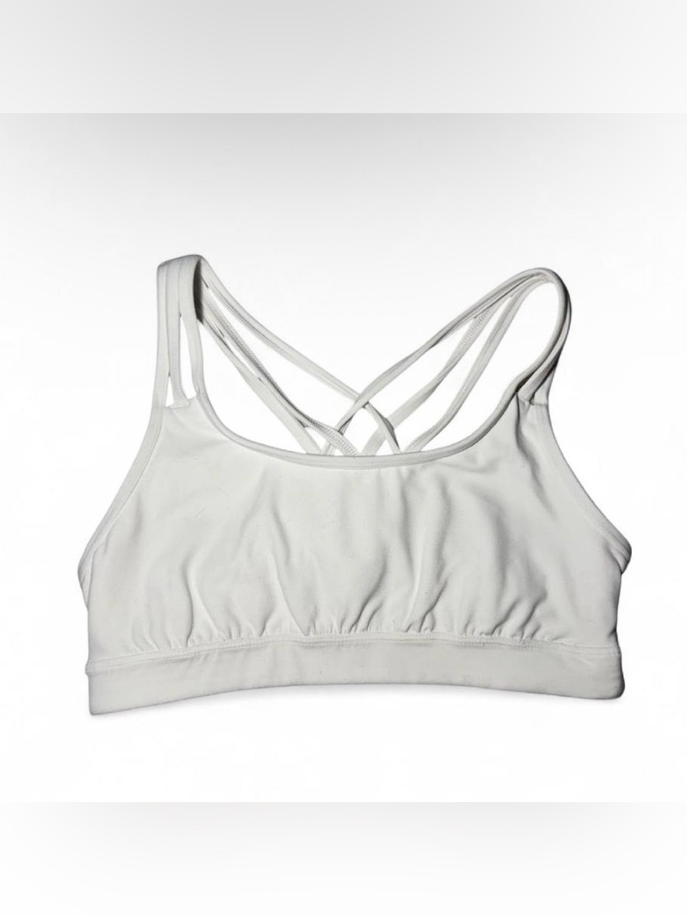 Athleta white sports bra with criss cross back Size M⏹️